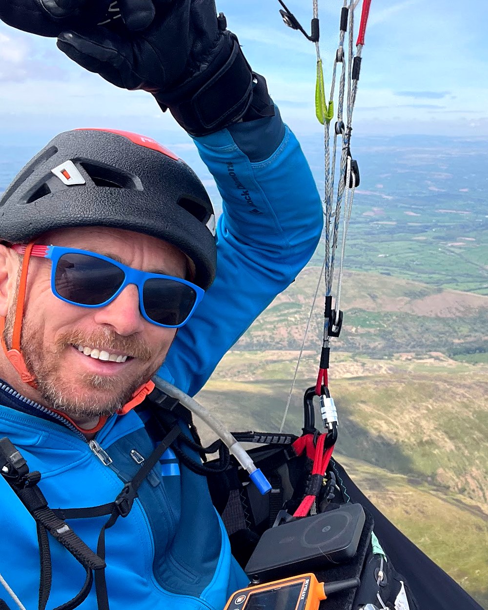 Dave Spooner paragliding over the British countryside